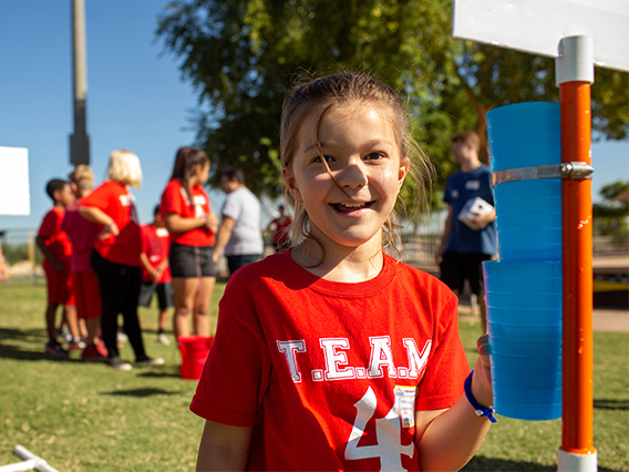 Arizona Water Festival Program. Girl at water festival event.